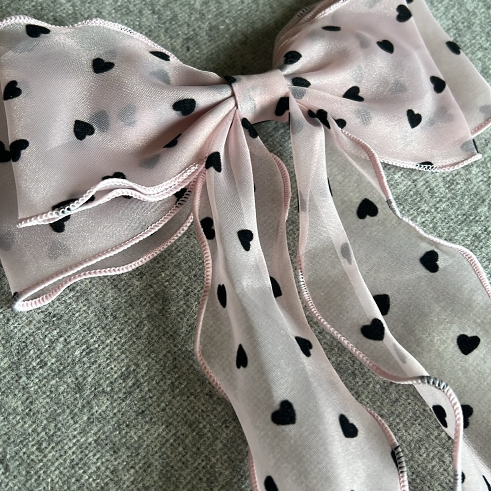 pink sheer bow with black hearts, hair clip. (Black hearts feel like velvet)